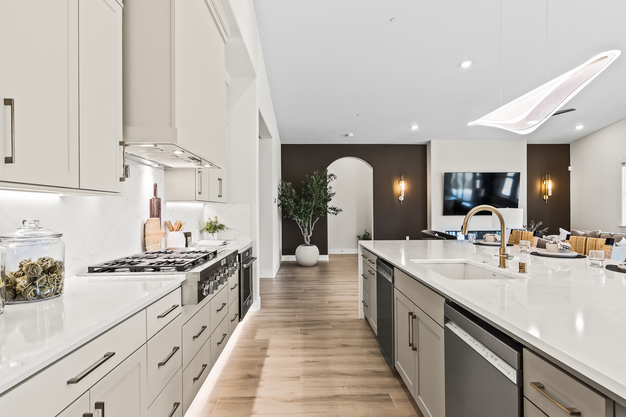 Wide angle of kitchen and great room in background