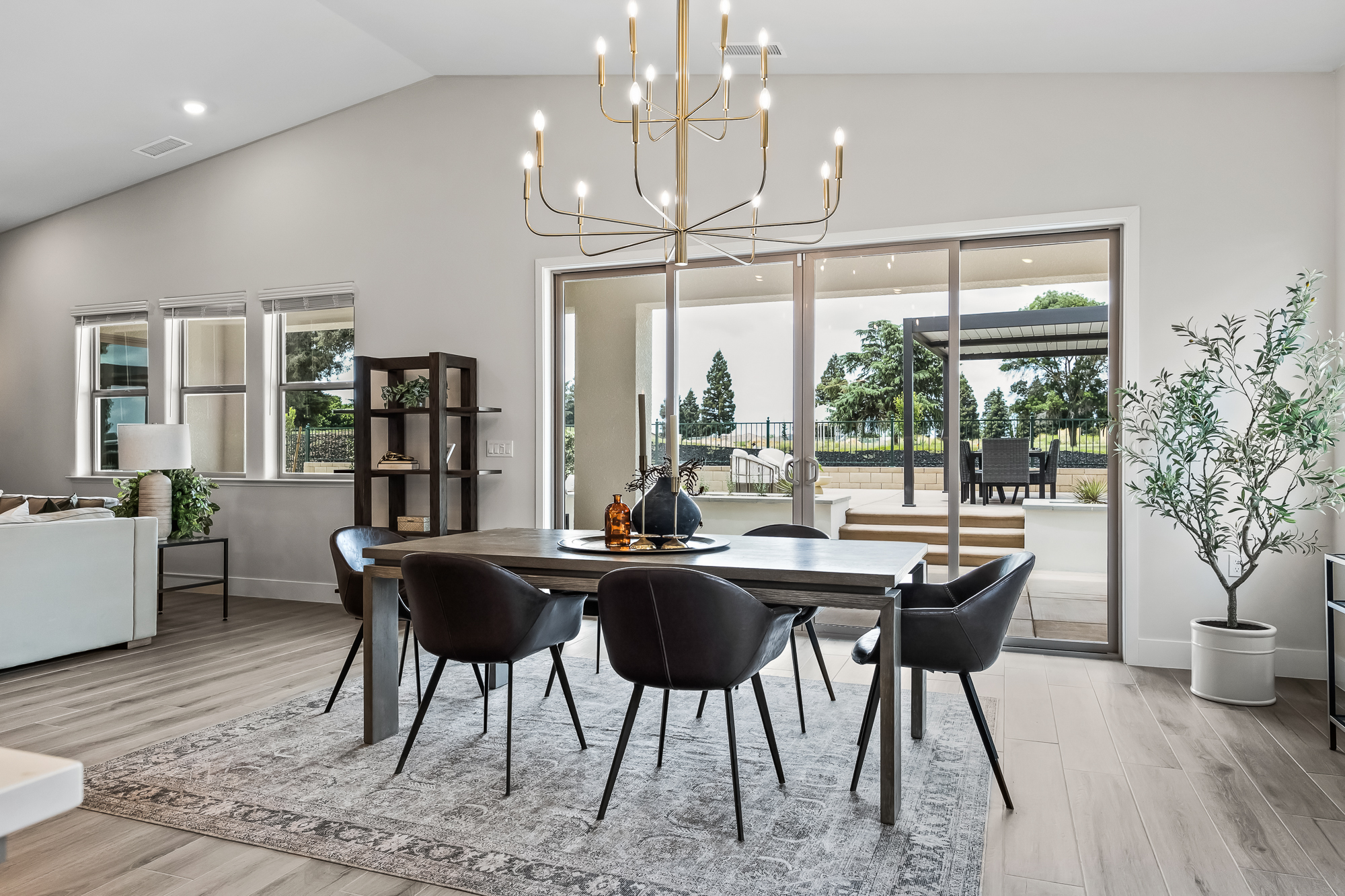 wide angle of dining area with backyard in view