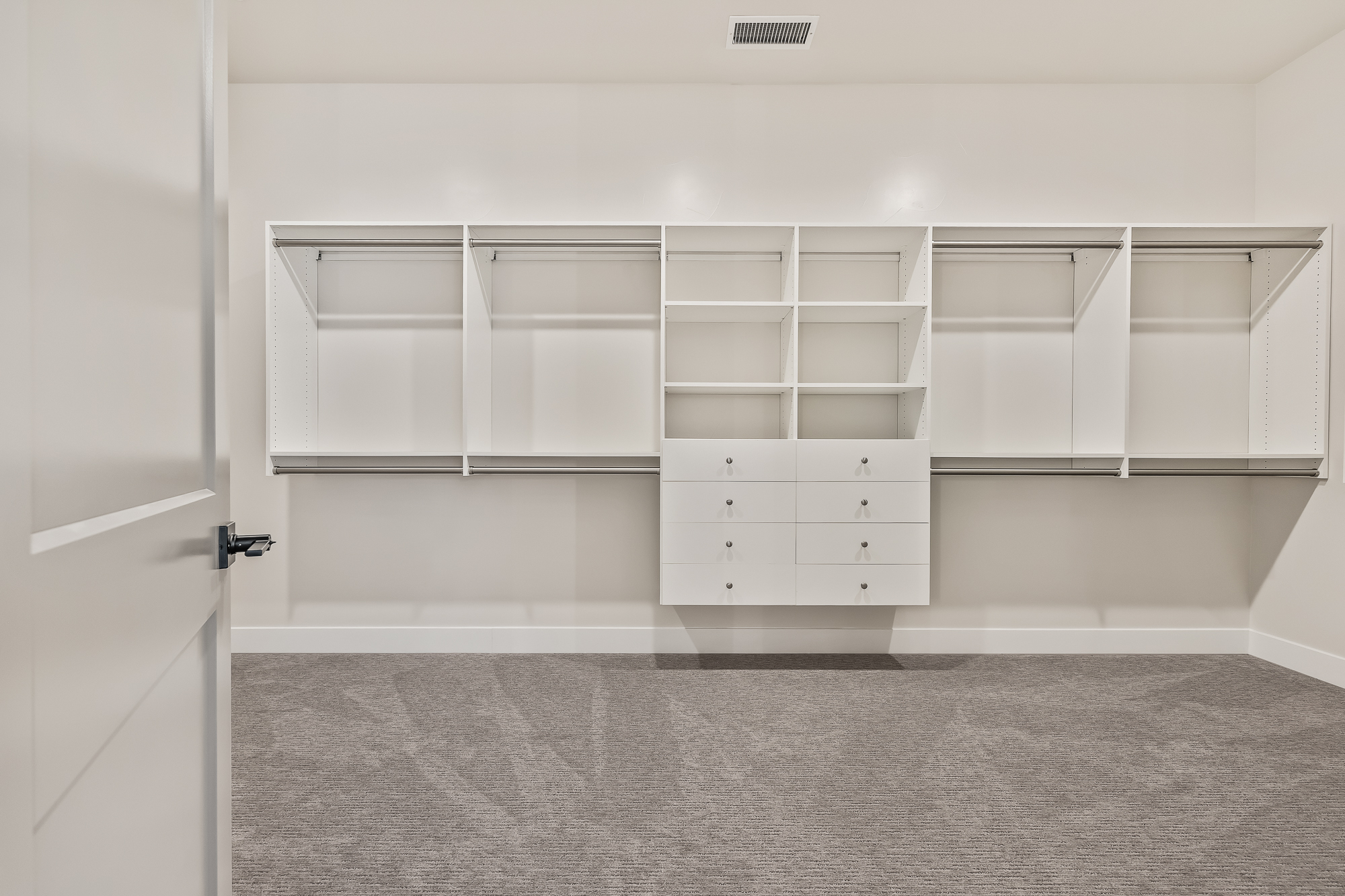wide angle of owner's wardrobe