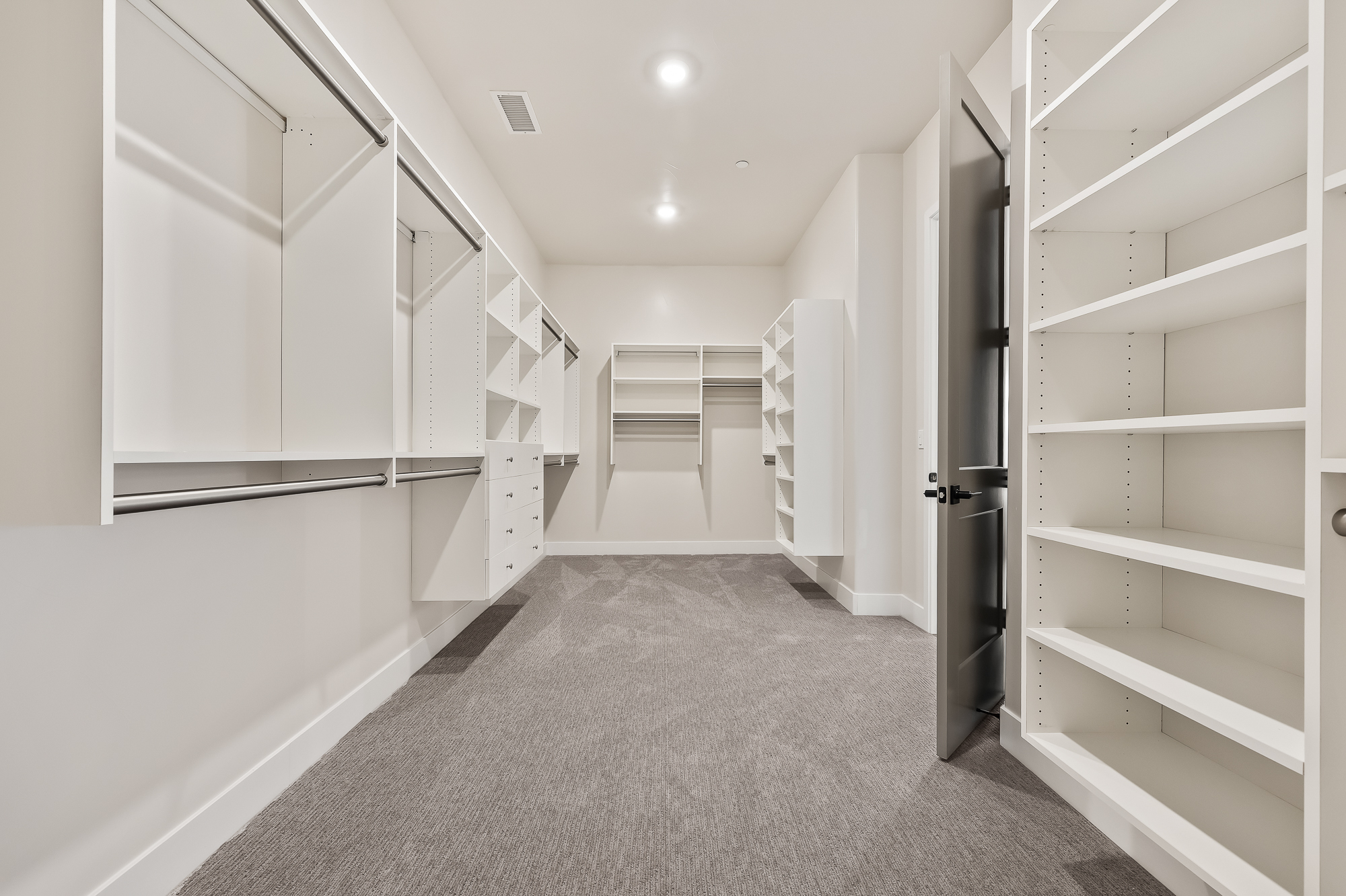 wide angle of owner's wardrobe