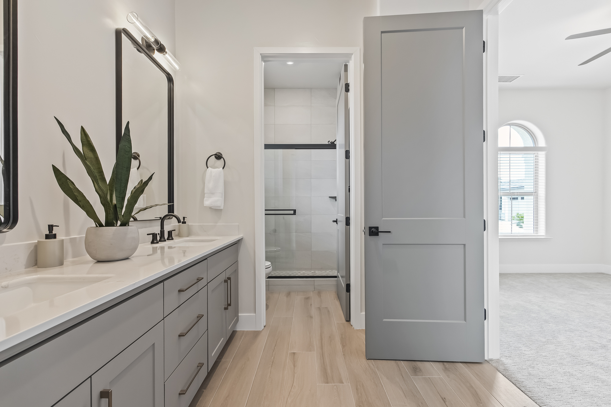 wide angle of bathroom 4 with dual vanity and shower