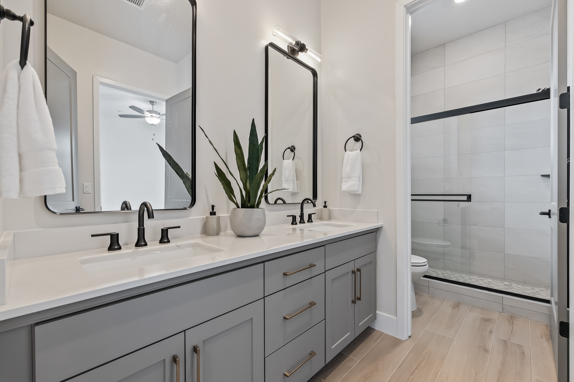 wide angle of bathroom 4 with dual vanity and shower