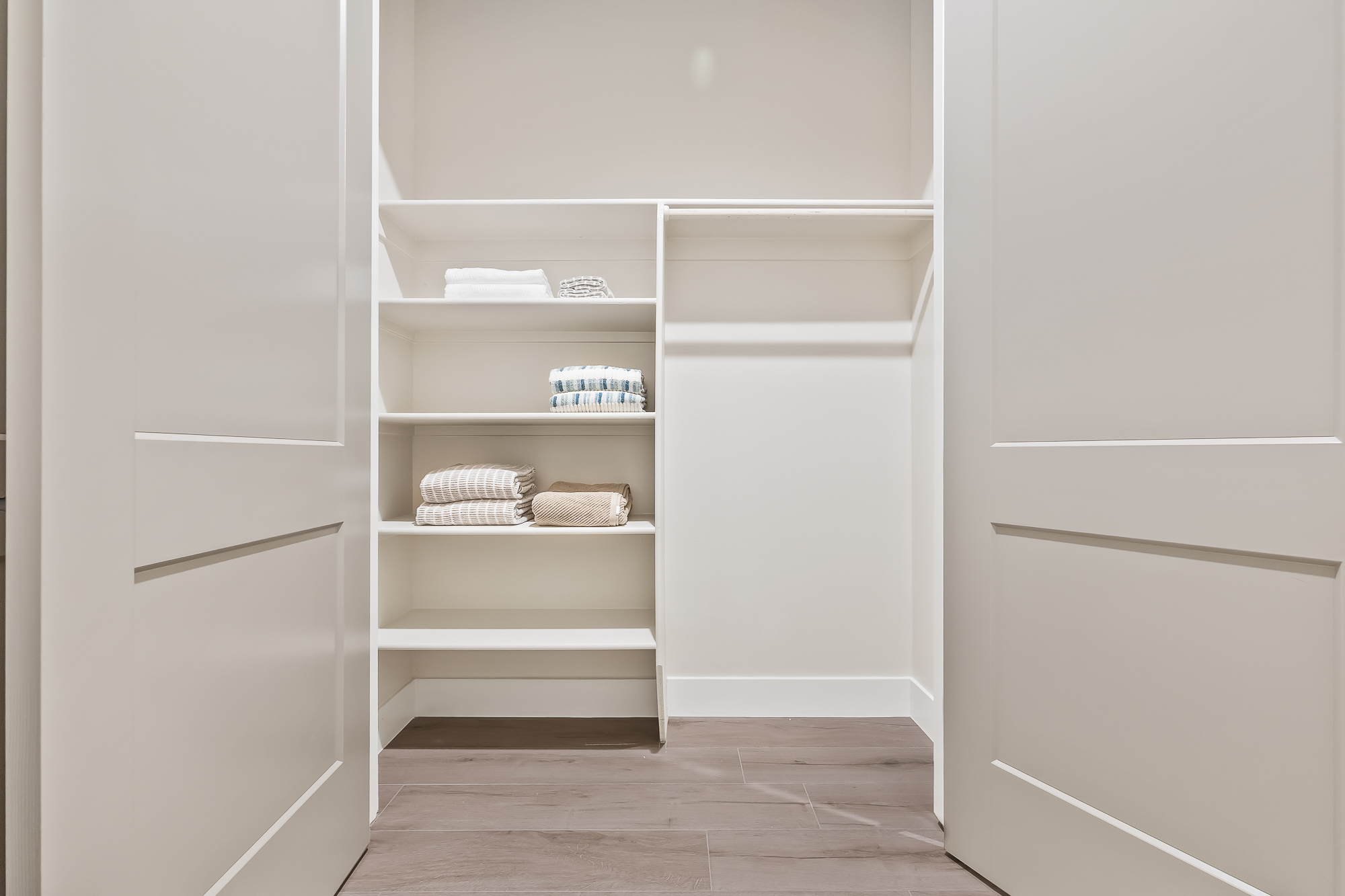 wide angle of laundry room storage and shelving