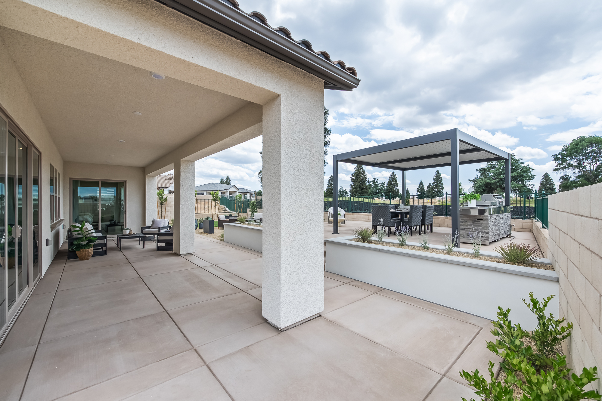 wide angle of backyard and covered patio