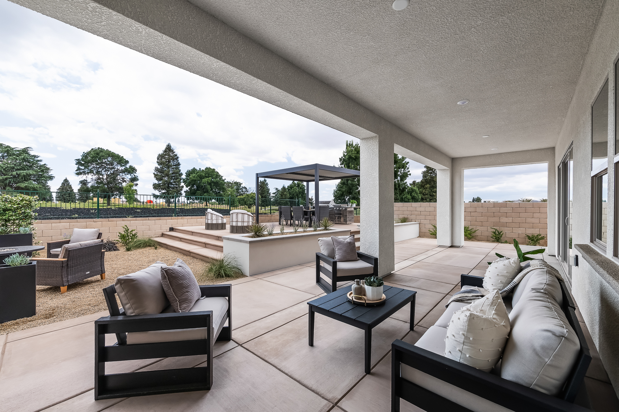 wide angle of backyard and covered patio