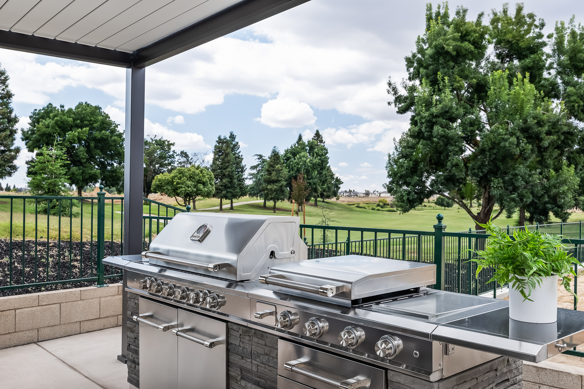 Close up of backyard bbq going to golf-course