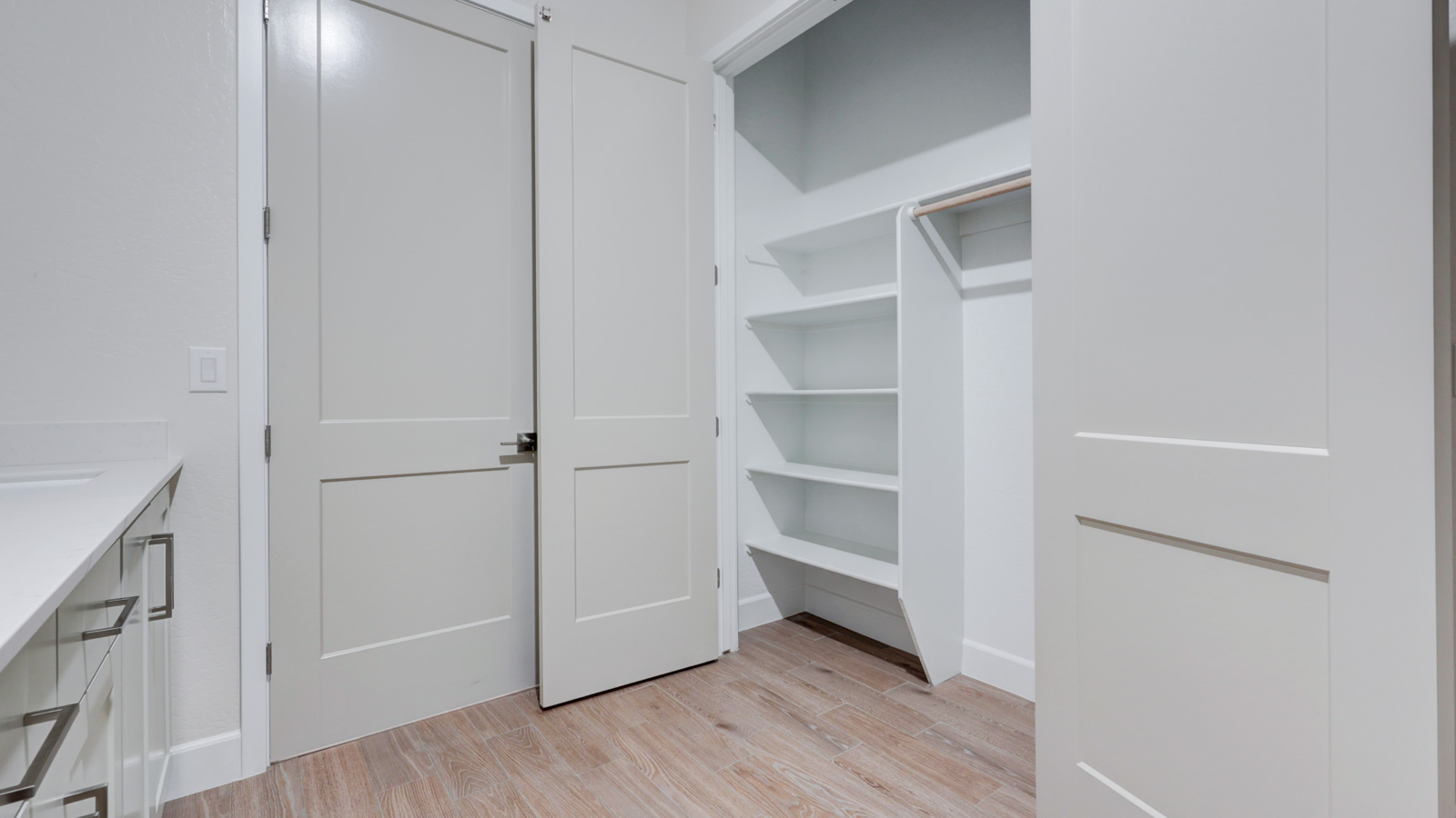 Laundry with sink, abundant cabinets and closet.