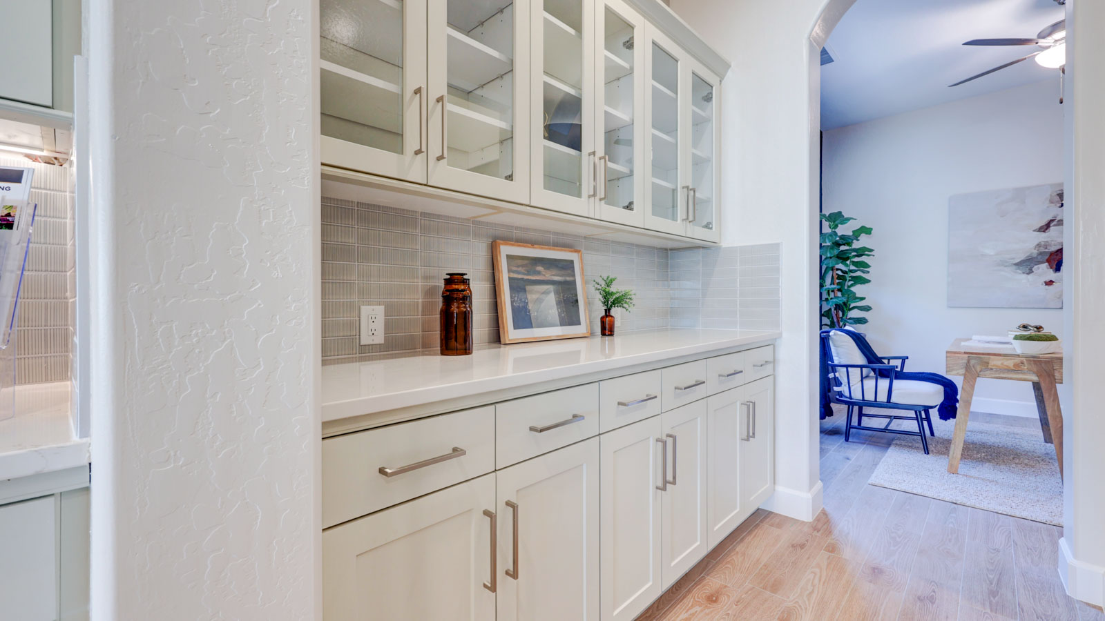 Butlers pantry adjacent to pantry.