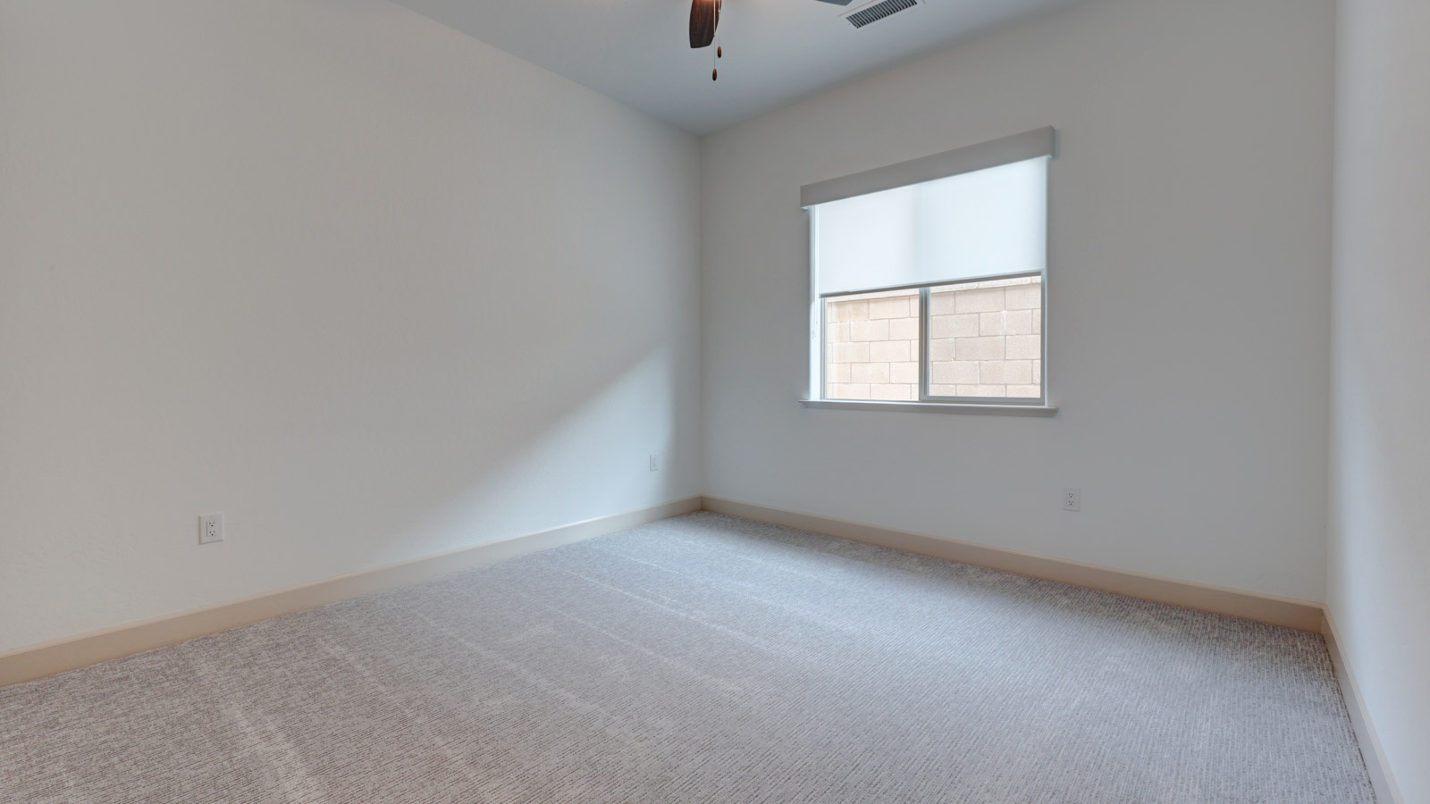 Bedroom with carpet and window blinds