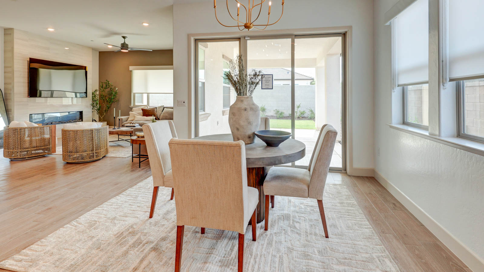 Dining nook with sliding door to rear yard and plank tile flooring.