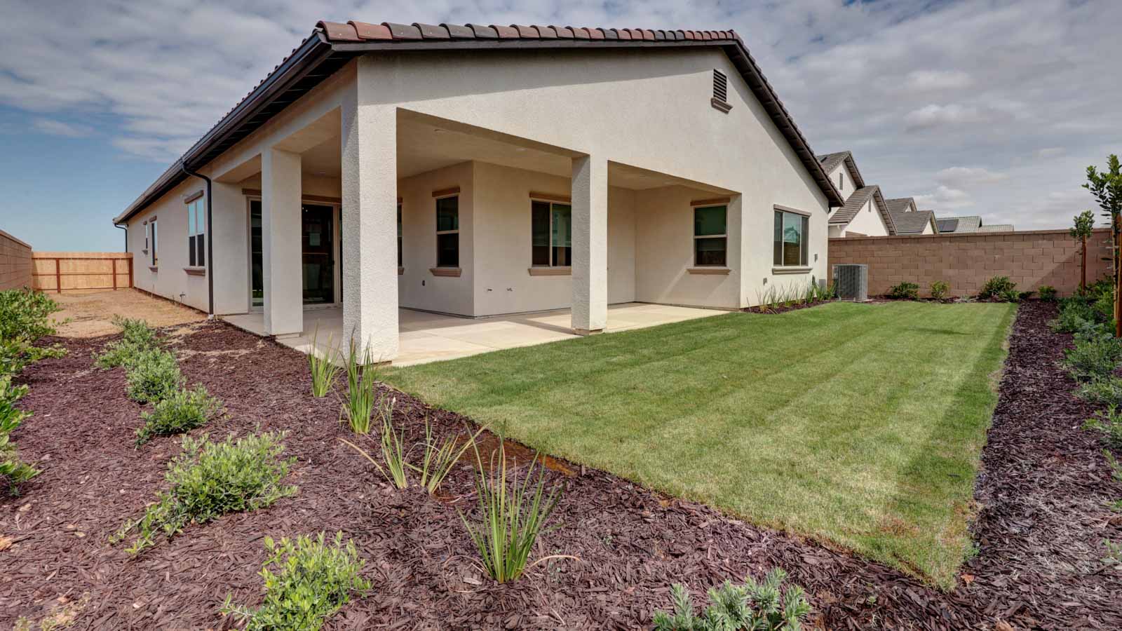 Fully landscaped rear yard and large covered patio.