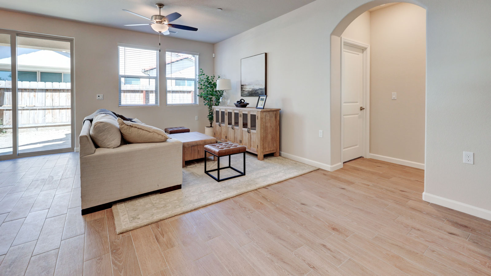 Great Room with tile flooring and three windows