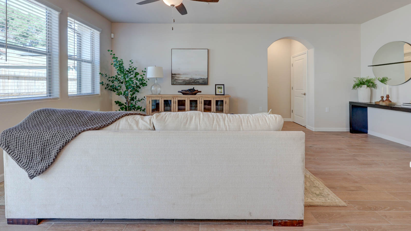 Great Room with tile flooring and three windows