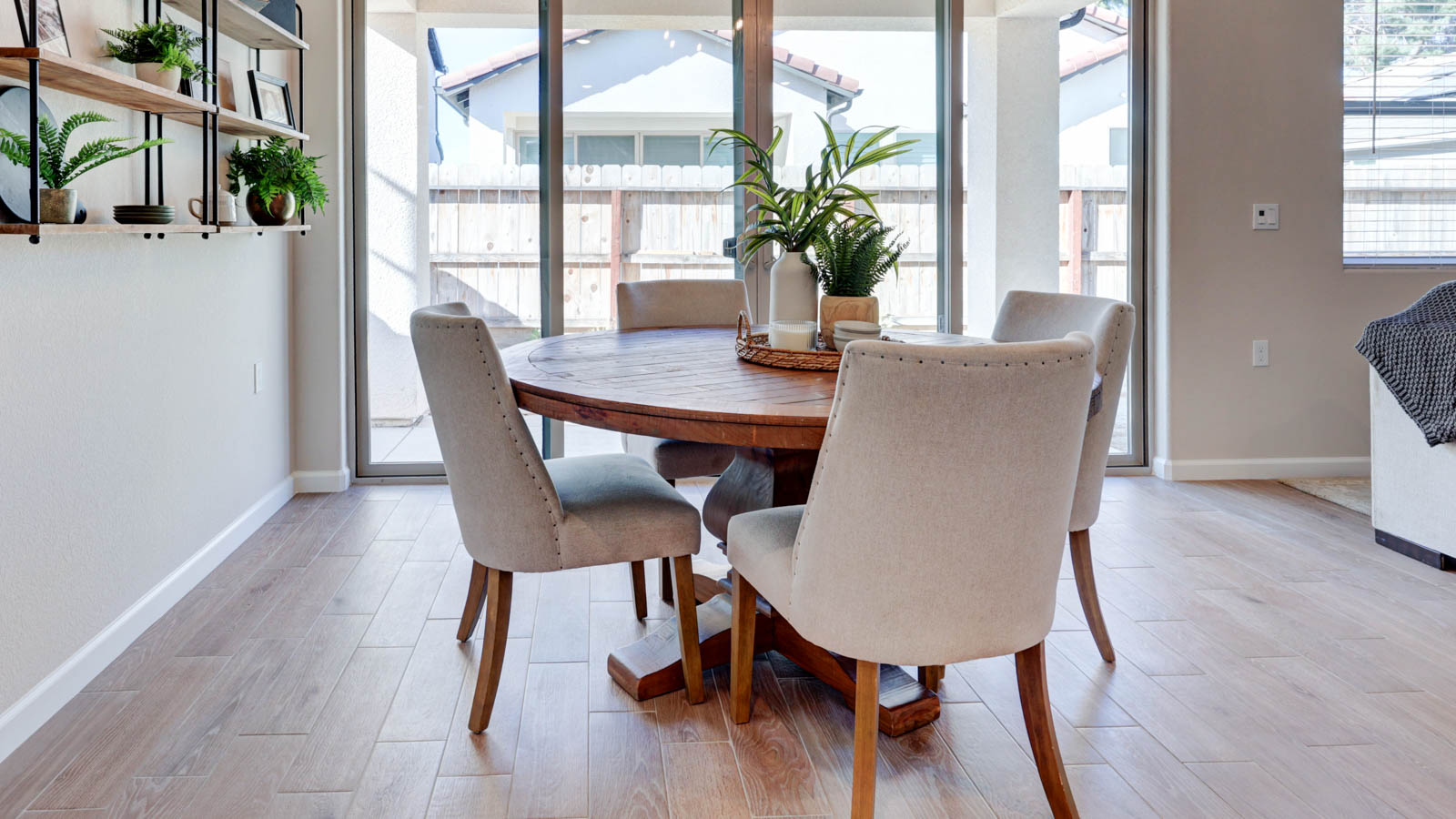 Dining nook with 9' slider and tile flooring