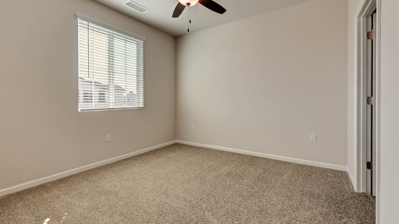 Upstairs bedroom with carpeting