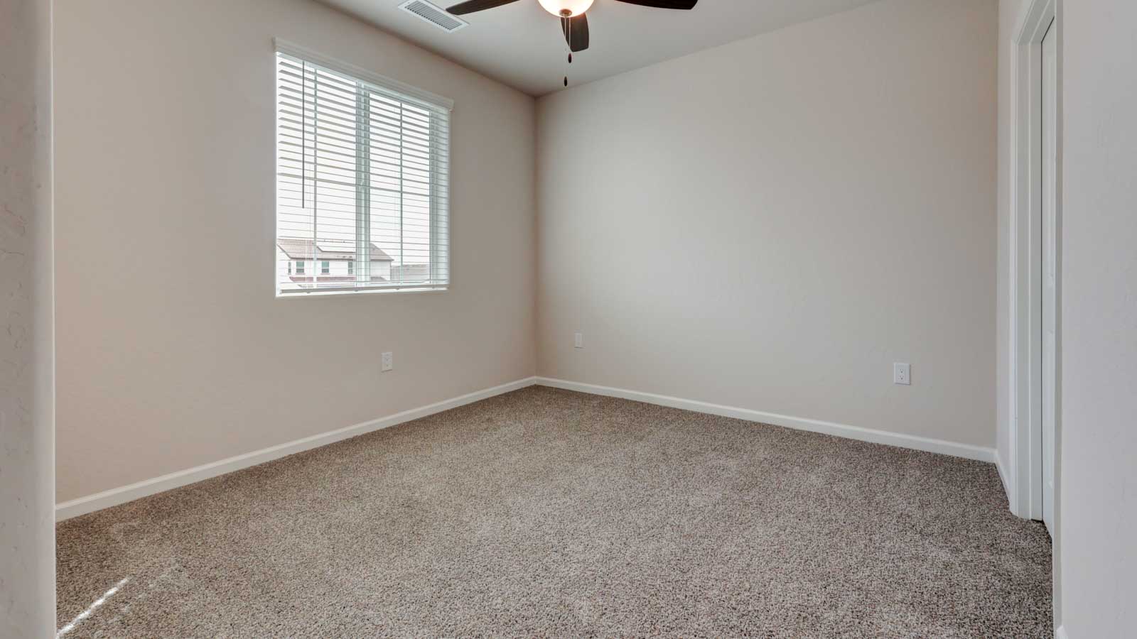 Bedroom 3 with blinds and carpeting