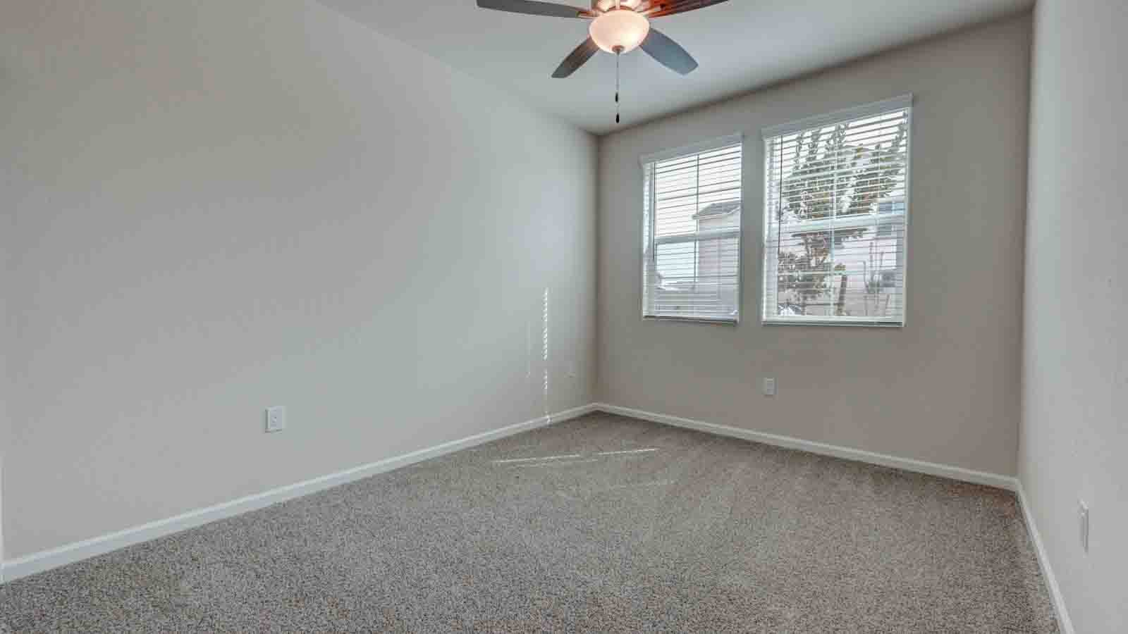 Bedroom 4 with blinds and carpeting