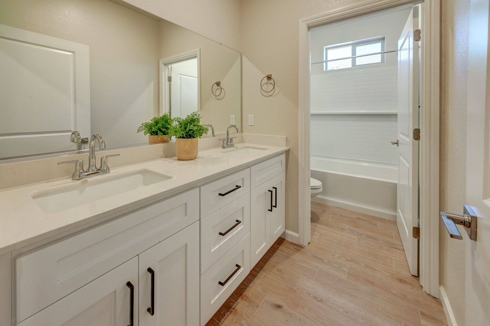 Bath with two sinks and separate toilet tub/shower area